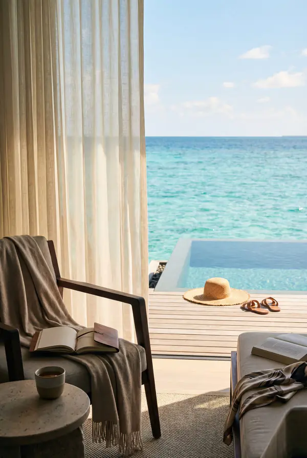 Maldives overwater villa with a private infinity pool and turquoise lagoon